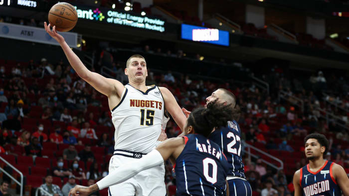 Denver Nuggets center Nikola Jokic (15) attempts to control the ball during the fourth quarter against the Houston Rockets.